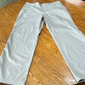 Nike Dry Fit light tan pants.  Flat front polyester/spandex.  Size 38 Waist